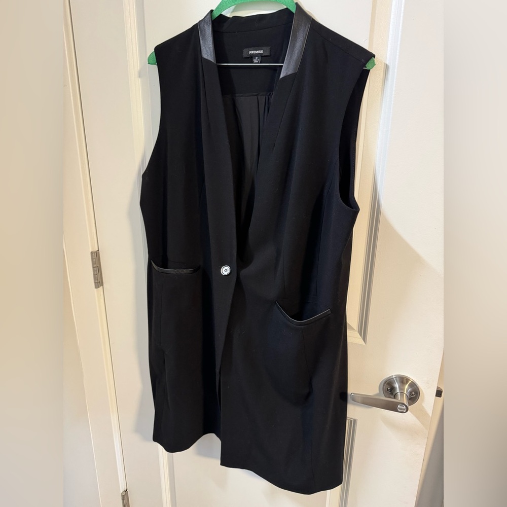 Long sleeveless blazer like new. Only worn once